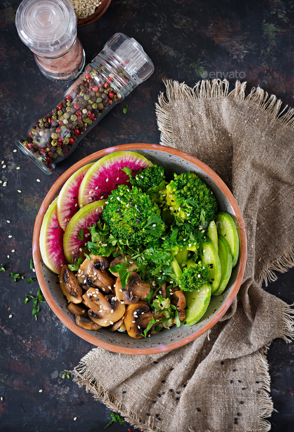 Healthy vegan lunch bowl. Grilled mushrooms, broccoli, radish salad. - Stock Photo - Images