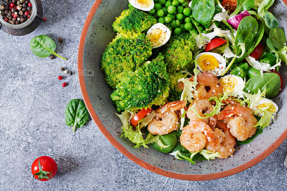 Grilled shrimps and fresh vegetable salad, egg and broccoli. Grilled prawns - Stock Photo - Images