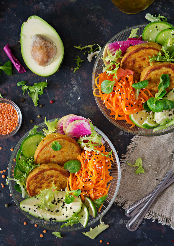 Healthy vegan lunch bowl. Fritter with lentils and radish, avocado, carrot salad. - Stock Photo - Images
