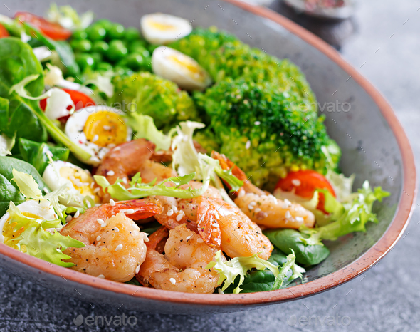 Grilled shrimps and fresh vegetable salad, egg and broccoli. Grilled prawns. - Stock Photo - Images