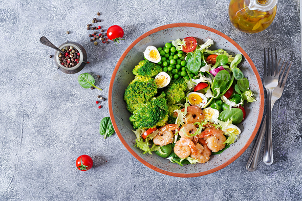 Grilled shrimps and fresh vegetable salad, egg and broccoli. Grilled prawns. - Stock Photo - Images