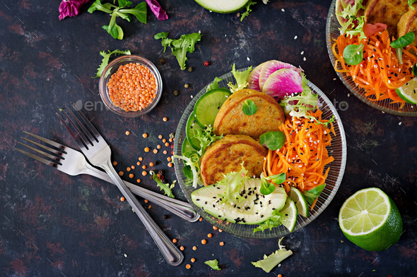 Fritter with lentils and radish, avocado, carrot salad. - Stock Photo - Images