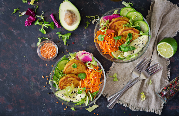 Fritter with lentils and radish, avocado, carrot salad. - Stock Photo - Images