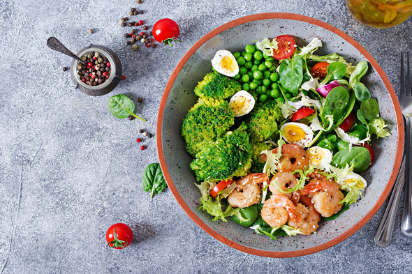 Grilled shrimps and fresh vegetable salad, egg and broccoli. Grilled prawns. Healthy food. - Stock Photo - Images