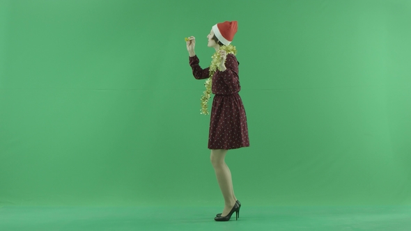 A Young Woman Dancing To the Left Side of the Green Screen