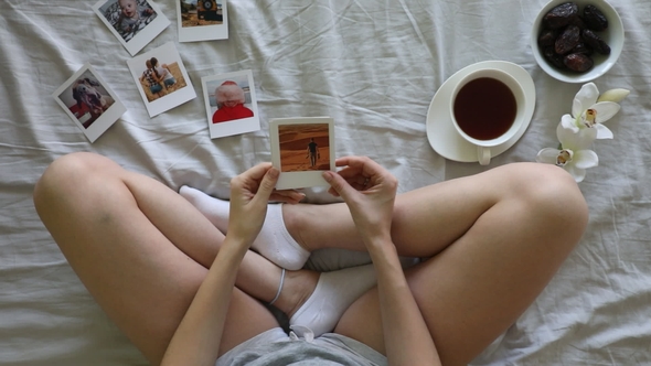 Top View of Young Woman with Photo