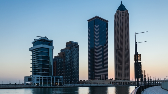 Sunset Over Embankment of Dubai Creek, Business Bay at Night. Dubai, UAE