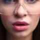 Face of a Sexy Woman in Construction Glasses . the Girl Is Erotically Chewing Gum. - VideoHive Item for Sale