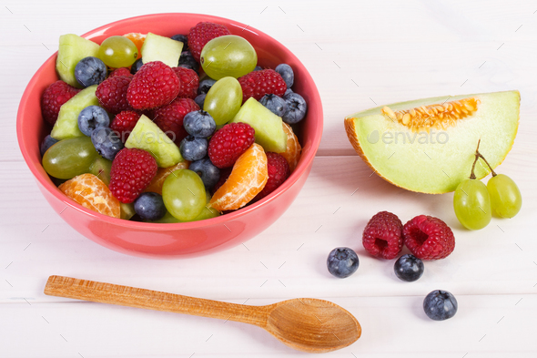 Fruit salad in bowl, healthy nutrition concept - Stock Photo - Images
