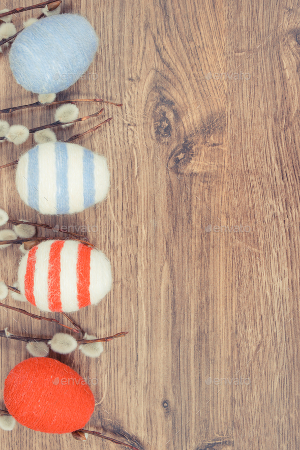 Easter catkins and eggs wrapped woolen string - Stock Photo - Images