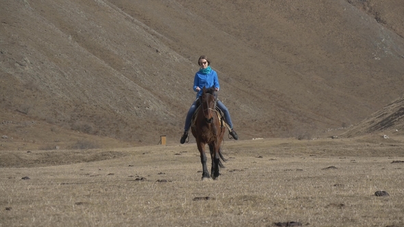 Rider Woman Rides a Horse