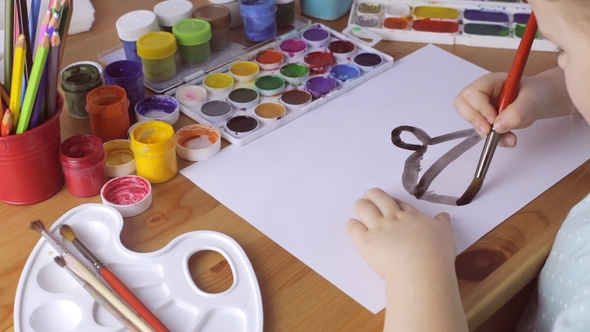 Young Girl Draws with Black Paints at Home. Psychological Problems Concept