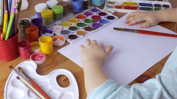 Young Cute Girl Dreams and Thinks What To Draw alt