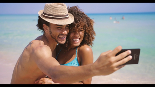 Cheerful Happy Couple Selfies on Beach alt