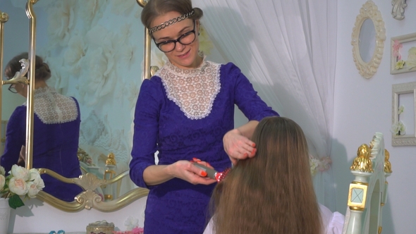 Mom Combs Her Daughter's Hair