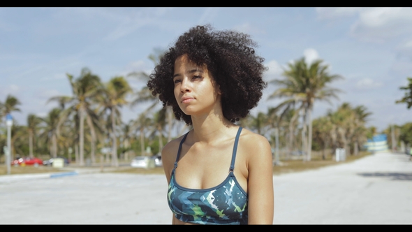 Relaxing Sportive Girl Walking on Street alt