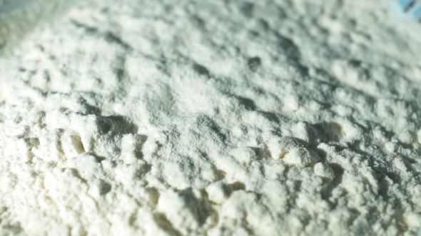 Flour Falling Through Sieve in a Kitchen