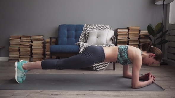 Fitness Woman Doing Plank Exercise on Mat at Home alt