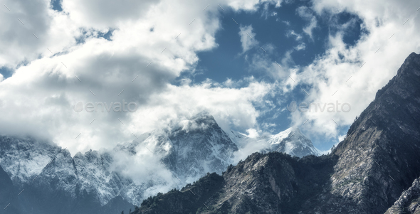 Majestical scene with mountains in clouds - Stock Photo - Images