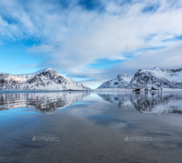 Sandy beach with beautiful reflection in water - Stock Photo - Images
