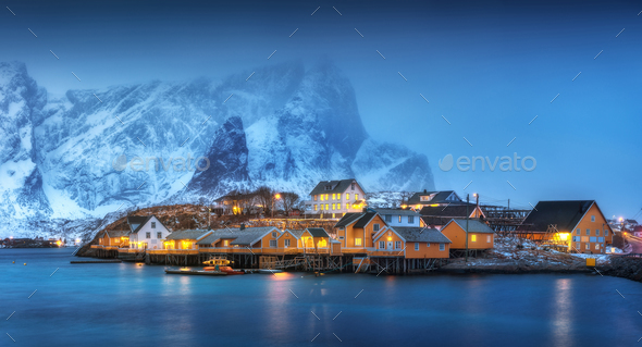 Beautiful yellow rorbuer and houses in Norway - Stock Photo - Images