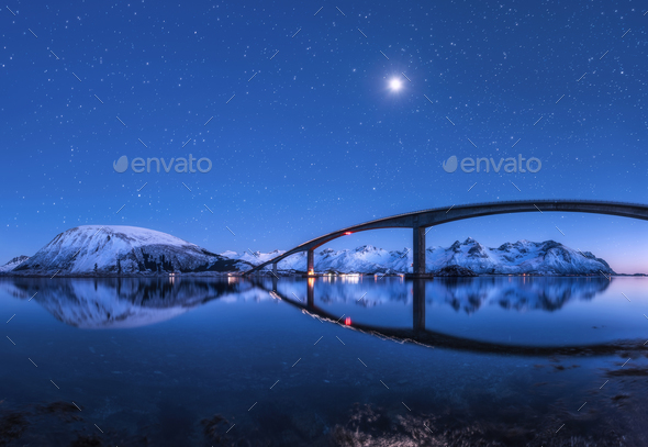 Bridge and starry sky with reflection in water - Stock Photo - Images