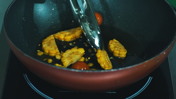 Chef Cooking Vegetables in Pan