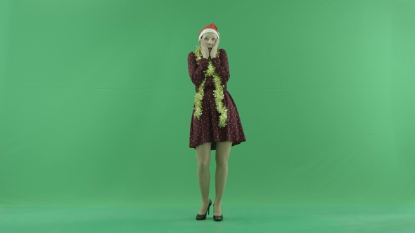 A Young Christmas Woman Is Showing Happiness on the Green Screen
