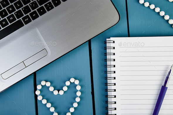 Modern women workplace with notebook or laptop. - Stock Photo - Images
