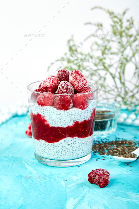 Healthy chia pudding with raspberries in glass - Stock Photo - Images