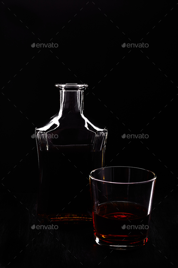 Glass of whiskey with bottle. Stock Photo by bondarillia | PhotoDune