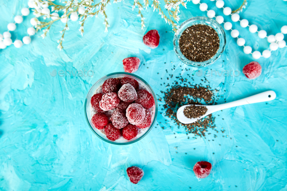 Healthy chia pudding with raspberries in glass - Stock Photo - Images