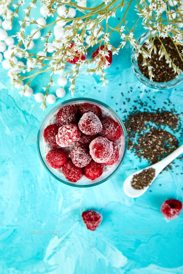 Healthy chia pudding with raspberries in glass - Stock Photo - Images