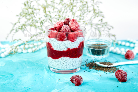 Healthy chia pudding with raspberries in glass - Stock Photo - Images