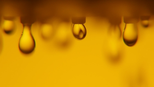 Blurred Water Blobs Come Down From a Shower Nozzle in a Yellow Bathroom