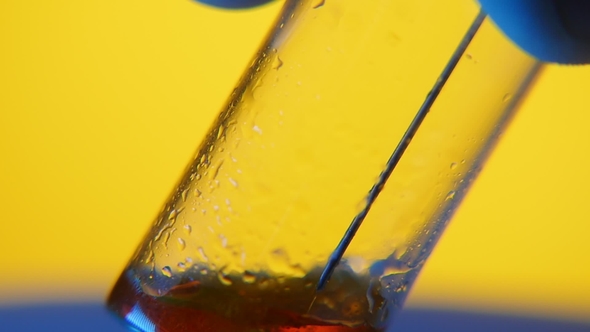 Red Blood Goes From a Syringe Into a Sample Tube in a Medial Laboratory