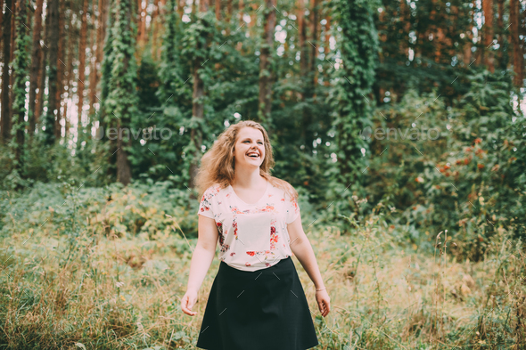 Young Pretty Plus Size Wavy Brown Hair Caucasian Laughing Girl W - Stock Photo - Images