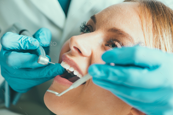 Dental drilling procedure Stock Photo by microgen | PhotoDune