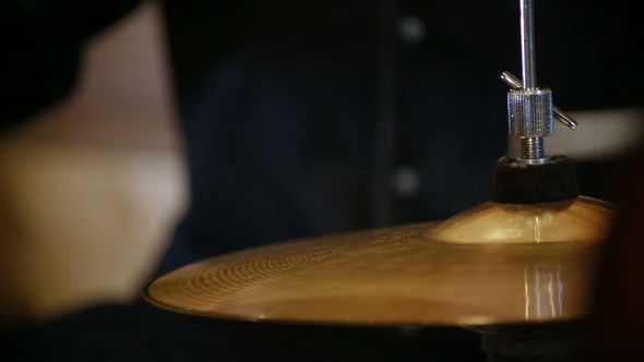 A  View of a Hi Hat Cymbal Played with a Drumstick