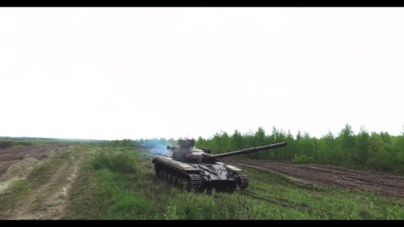 Military Tank In Movement On A Dirt Ground Terrain alt