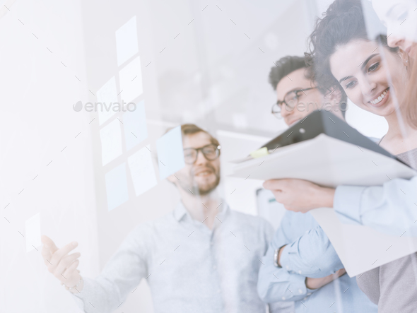 Young business team meeting in the office - Stock Photo - Images