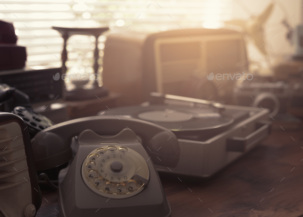 Vintage objects collection next to a window - Stock Photo - Images