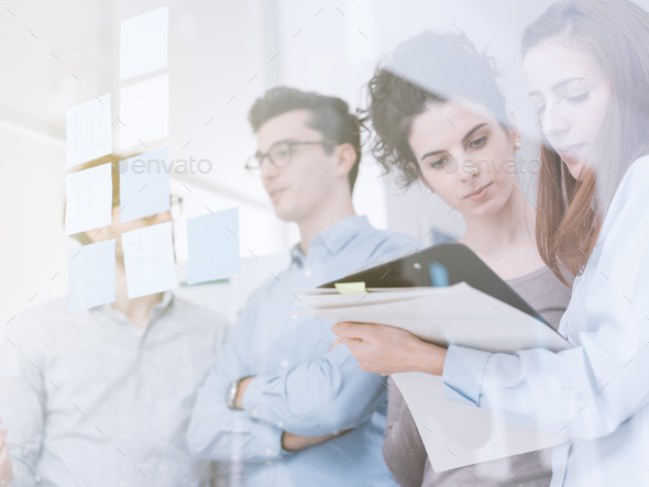 Young business team meeting in the office - Stock Photo - Images