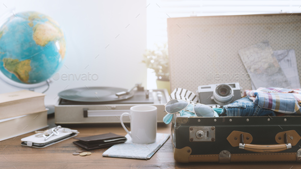Traveler packing his suitcase before leaving - Stock Photo - Images