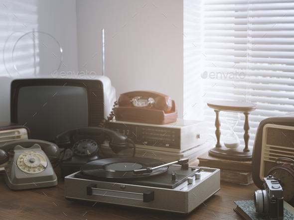 Vintage objects collection next to a window - Stock Photo - Images