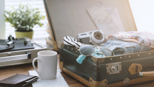 Traveler packing his suitcase before leaving - Stock Photo - Images