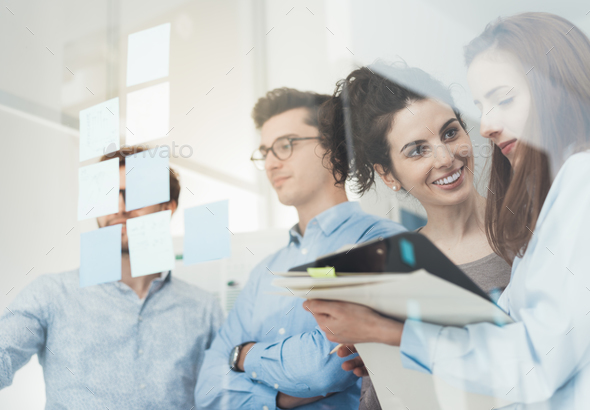 Young business team meeting in the office - Stock Photo - Images