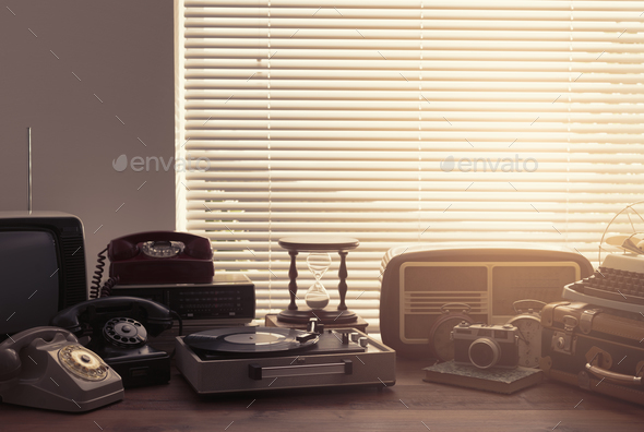 Vintage objects collection next to a window - Stock Photo - Images