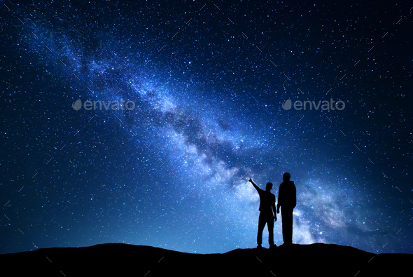 Night landscape with Milky Way and silhouette of men - Stock Photo - Images