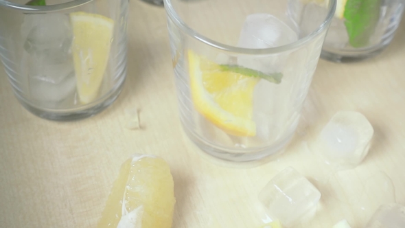 The Liquid Pours Into the Glass on the Table